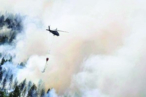 A National Guard Chopper battles the Cold Springs fire. Photo courtesy of the National Guard via Flickr under the Creative Commons 2.0 License (creativecommons.org/licenses/by/2.0/legalcode)