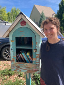 Annabel Stewart with their Little Free Library